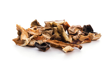 Heap of dried homemade mushrooms isolated on a white background in close-up.