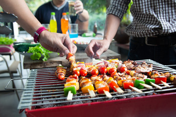 Barbeque Grill Street Food in thailand,Eat outdoors in a happy family.