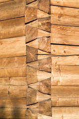 New wooden assembly of logs closeup in sunny day