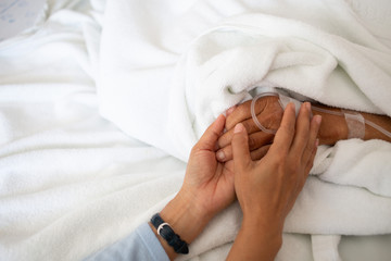 doctor's hands are encouraging the patient to have life support.