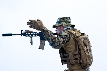 soldier in action aiming laseer sight optics