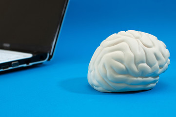 artificial brain and a laptop, the concept of artificial intelligence