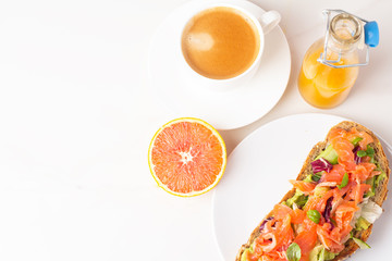 toast with salmon, coffee and juice on a white background