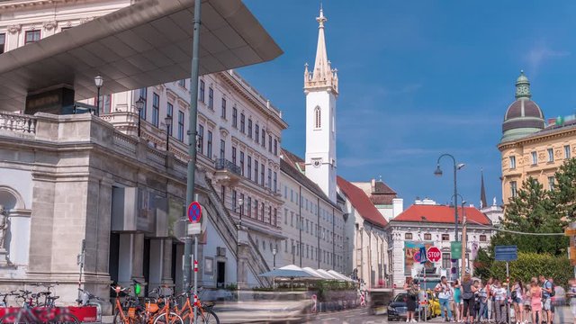Albertina Square aerial timelapse with historic buildings, tower, tourist buses, people and traffic in downtown Vienna, Austria