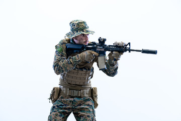 Fototapeta na wymiar soldier in action aiming laseer sight optics