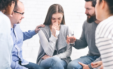 Understanding people giving support to crying woman
