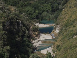 Fototapeta na wymiar Cavagrande del Cassibile – panorama of the Natural Park consisting of a canyon with a series of waterfalls and lakes on the bottom