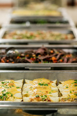 buffet food in chafing dishes at dinner event