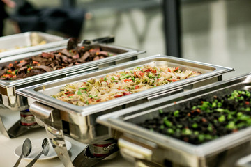 buffet food in chafing dishes at dinner event - obrazy, fototapety, plakaty