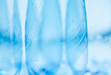 Empty plastic bottles in macro shot on white background
