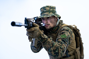 Fototapeta premium soldier in action aiming laseer sight optics