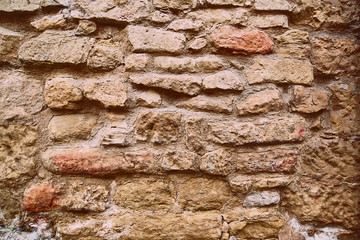 sandstone wall with bricks as a background