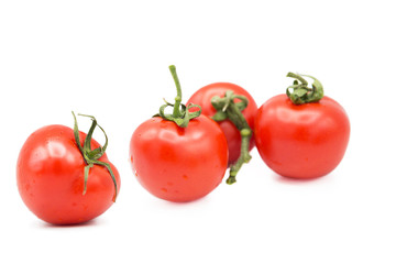 ripe fresh organic tomatoes in drops of water Isolated on a white background