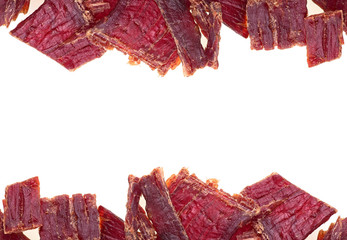 Beef jerky isolated on a white background, top view.