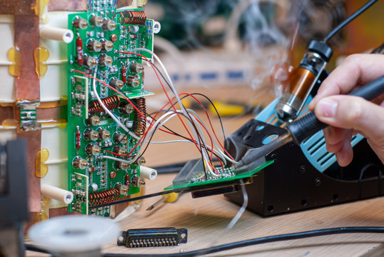 Shot in the electronic laboratory, during tin soldering, for repair