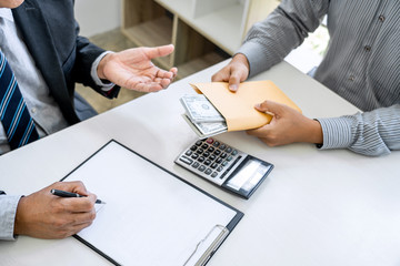 Bribery and corruption concept, bribe in the form of dollar bills, Businessman giving money in the...