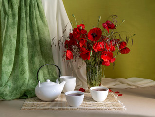 The bouquet of wild poppies, and tea service with tea