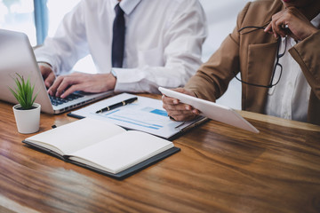 Business team colleague working with new startup project plan and discussion information for financial strategy with laptop and digital tablet results of their successful teamwork