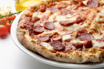 pizza with salami on the white background