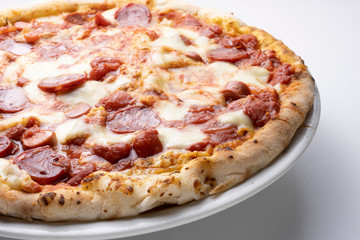 pizza with salami on the white background