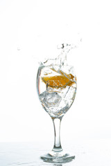 Mineral water with ice cubes and lemon slice