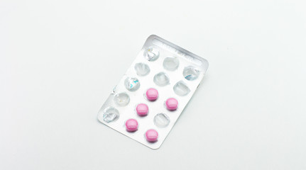 Blister with opened pink tablets.