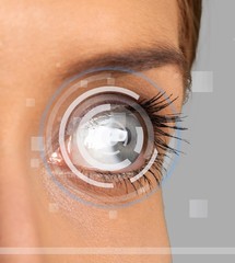 Close up of female eye with digital hologram