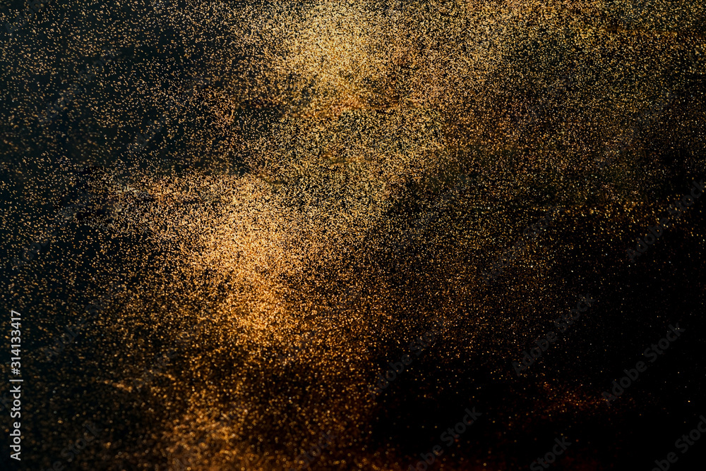 Poster black background with golden sparkles. blurred effect. concept for festive background or for project