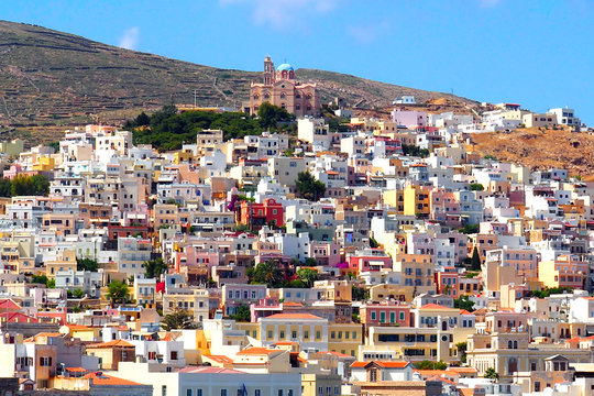 the city of Ermoupoli, "the city of Hermes", overlooked by two cathedral, one of which is Orthodox, is the capital city of Syros, beautiful Cyclades island in the heart of the Aegean Sea