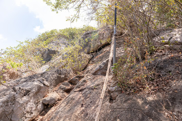 Fototapeta premium Cliff waiting for people to climb up with a rope to facilitate.With the sky as the target