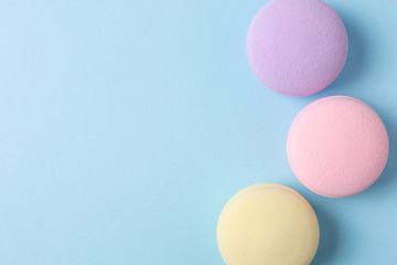 makeup sponges on a blue background