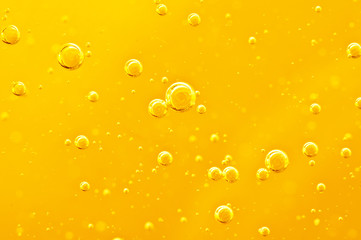 Oil background. Golden liquid with air bubbles on white background  for projects, oil, honey, beer,...