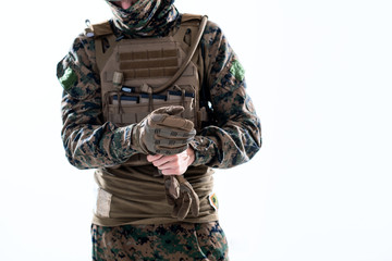 closeup of soldier hands putting protective battle gloves