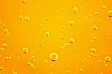 Oil background. Golden liquid with air bubbles on white background  for projects, oil, honey, beer, juice, shampoos.