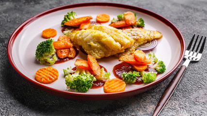 Food banner format. Fillet of sea bass with vegetables. Baked fish, cauliflower and carrots
