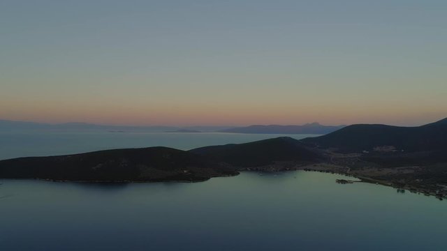 Mediterranean coast and bay video at sunset. Truck shot. Drone, aerial shot. Greece, Europe, summer.