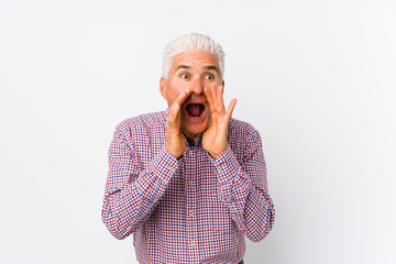 Senior caucasian man isolated shouting excited to front.