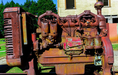 Old and rusty engine of an old truck in front of the 