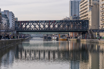 Fototapeta na wymiar Paris, France - 12 29 2019: Ourcq Canal. Railway bridge