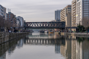 Fototapeta na wymiar Paris, France - 12 29 2019: Ourcq Canal. Railway bridge