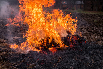 Fire burns straw field after harvest