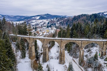 Aerial drone view on railway viaduct at winter