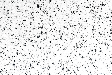 Grunge distressed splatter background spray paint drops. Black ink splashes.
