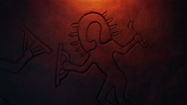 Ancient Astronaut Carving Lit Up With Fire