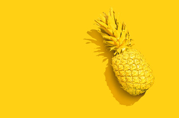 Yellow pineapple on a yellow background - 314143250