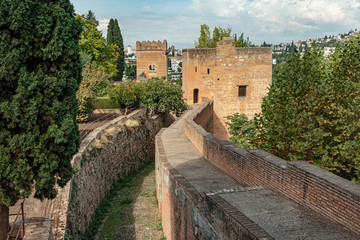 Fototapeta na wymiar View of corridor along the fortified walls of Alcazaba, citadel of Alhambra, Spain. Strong protection found in this palace in Granada