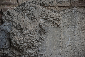 Dark uneven cement brick texture