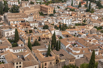 Fototapeta na wymiar Aerial top view of Granada city in Spain. Houses in the city of Granada in Andalusian neighborhood, Spain
