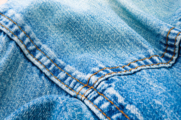 clothing items blue stonewashed faded jeans cotton fabric texture with seams, clasps, buttons and...