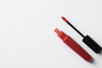 Red lipstick on white background	